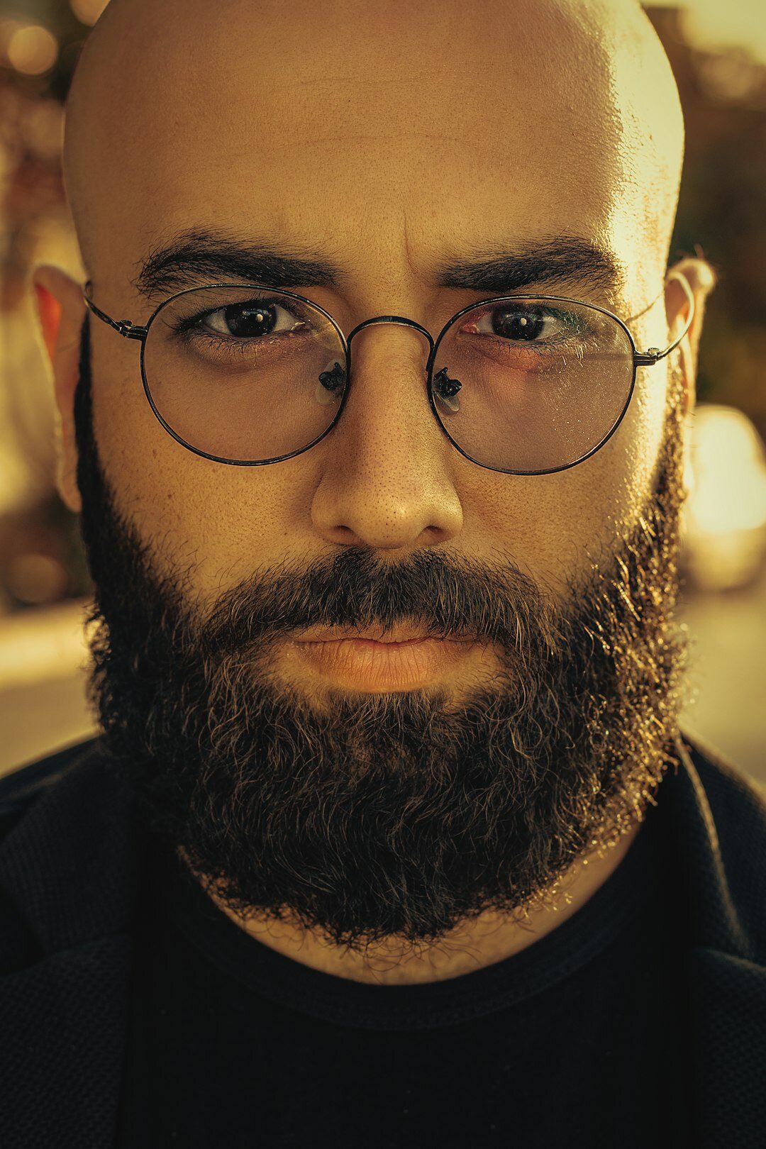 Portrait of a middle aged Argentine man with short beard and glasses
