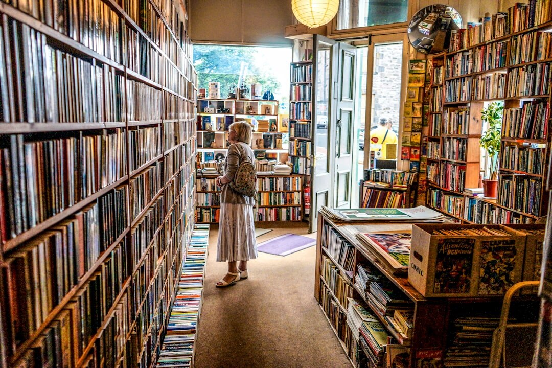 Interior of a charming independent bookstore with tall wooden shelves