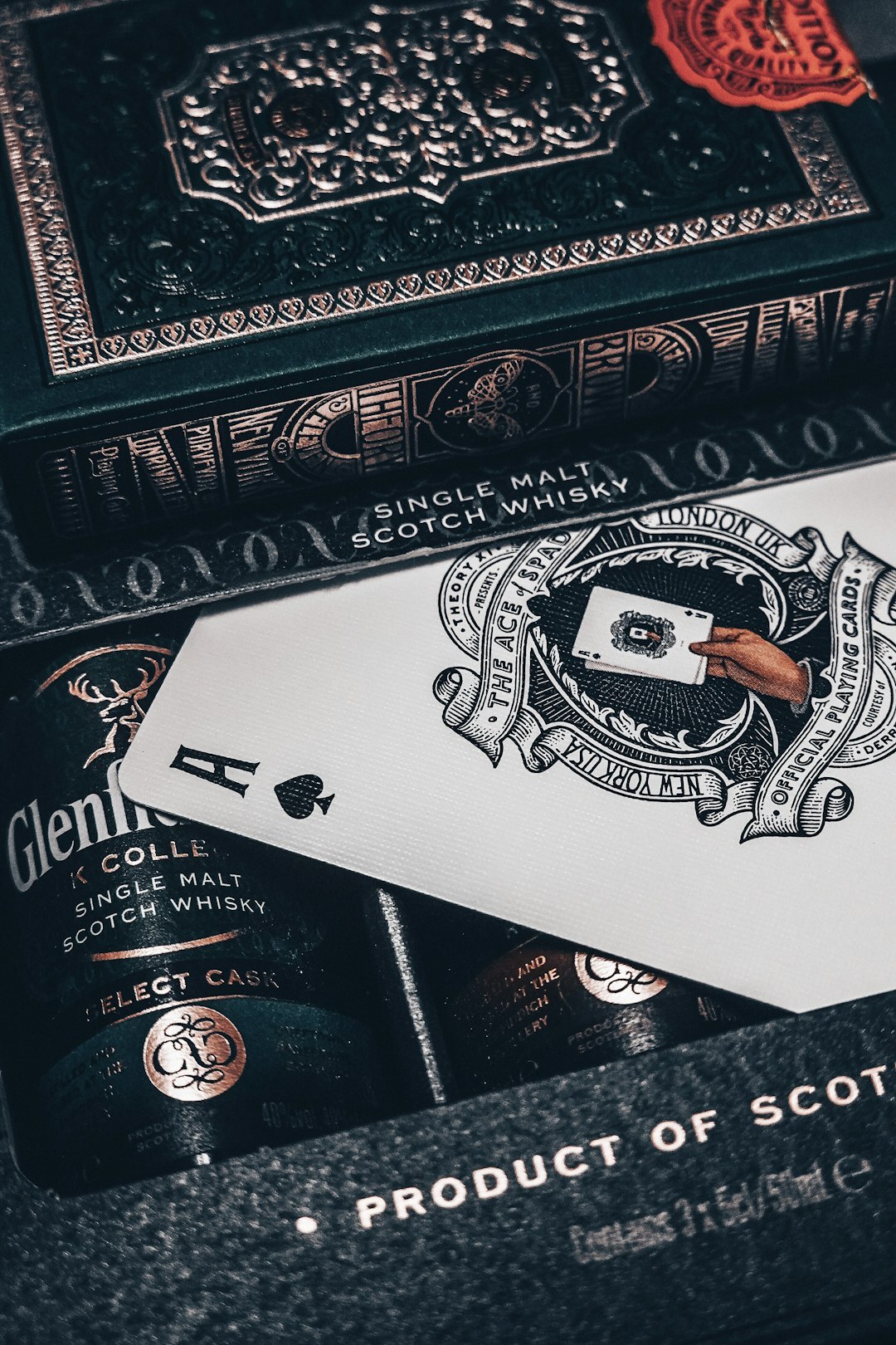 Illustrated crime novel cover with an antique revolver and playing cards