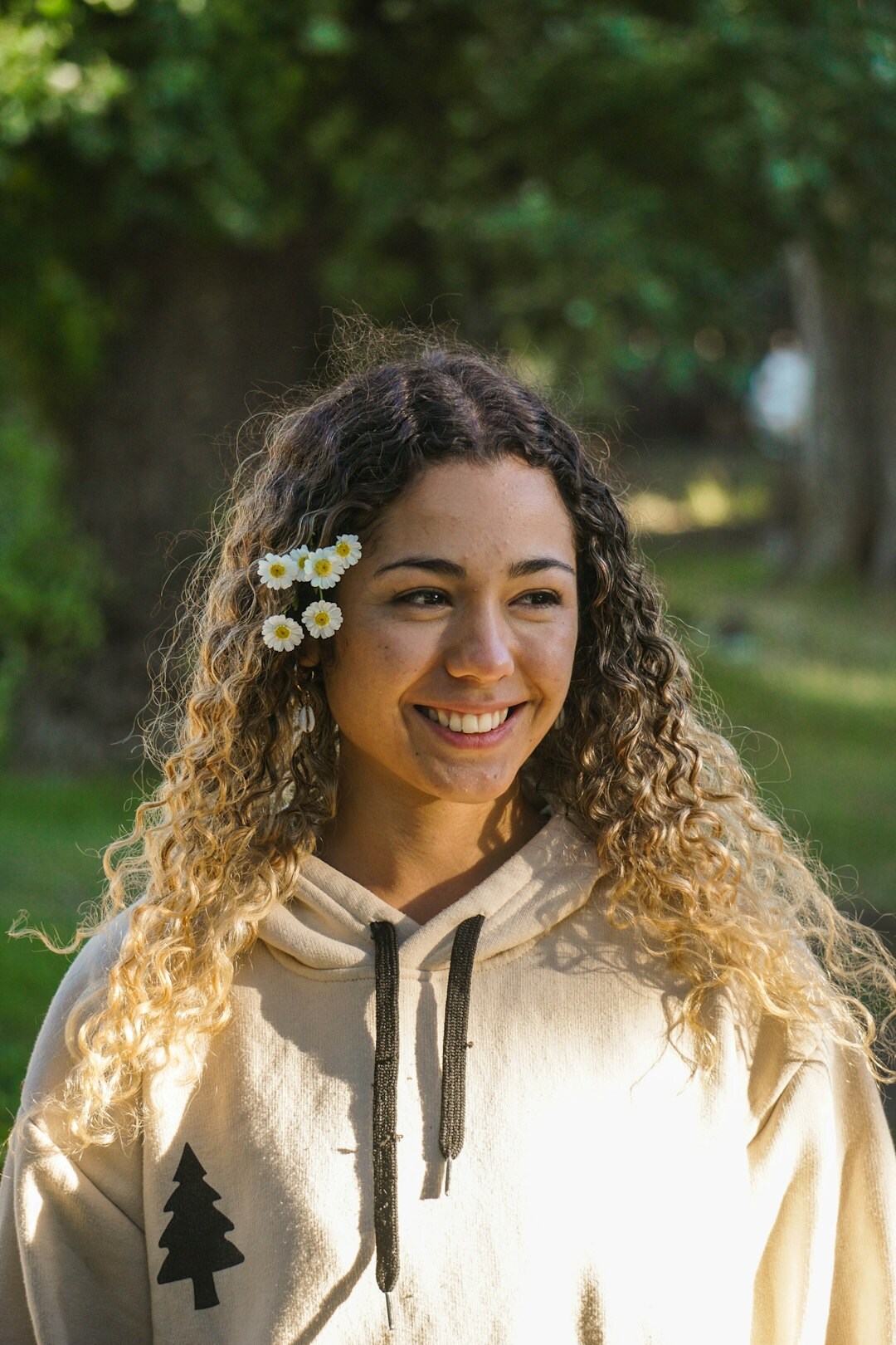 Portrait of a young Argentine woman with curly dark hair smiling